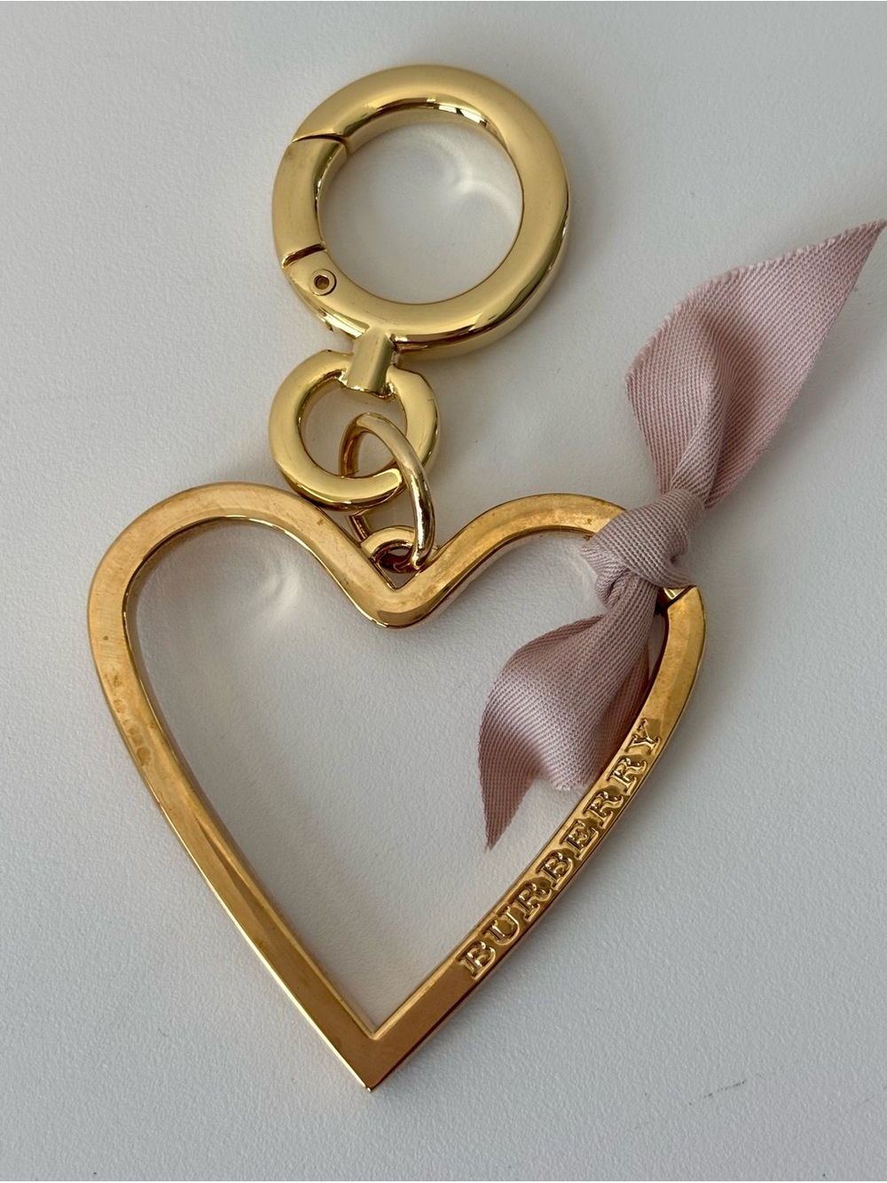 Burberry Gold Toned Heart Keychain/Bag Charm with Blush Ribbon Accent. NIB